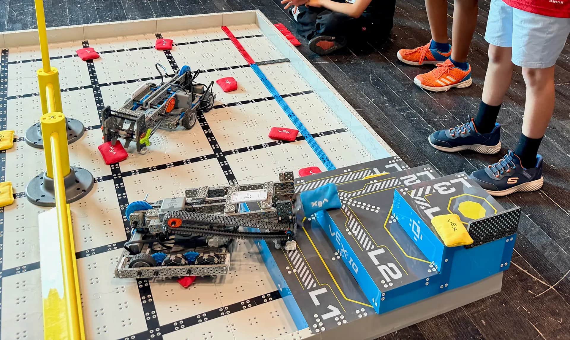 VEX Robotics robots competing on a game field