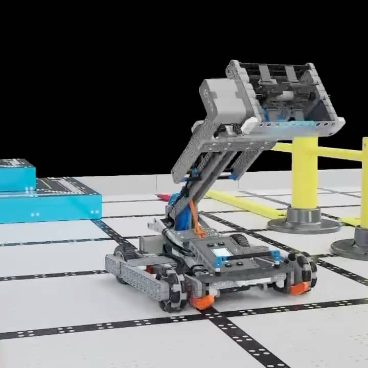 VEX IQ robots lifting and scoring on a competition field