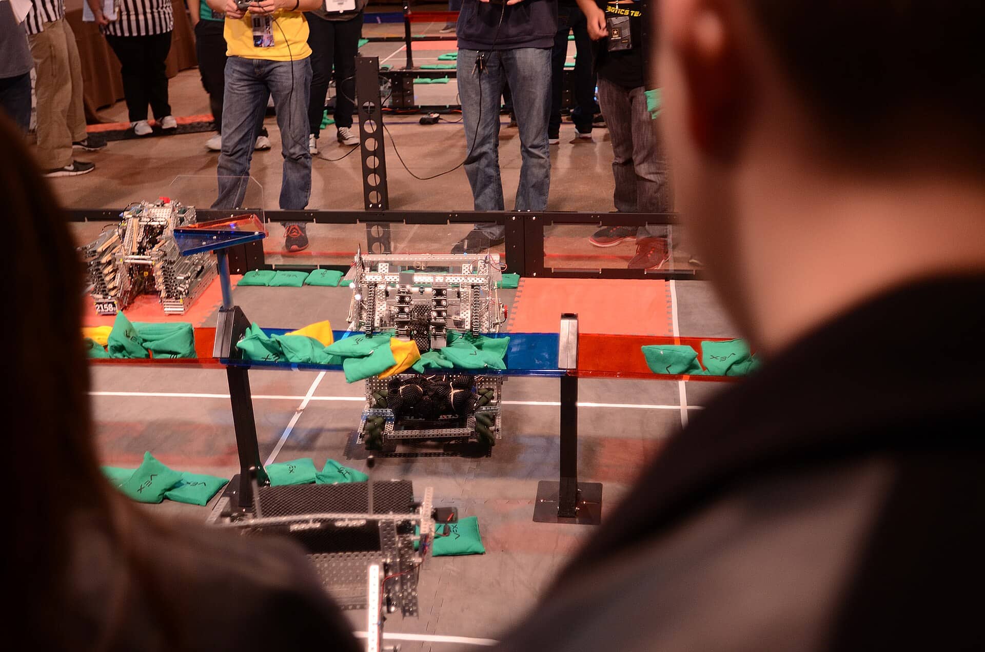 Robots competing on a VEX tournament field